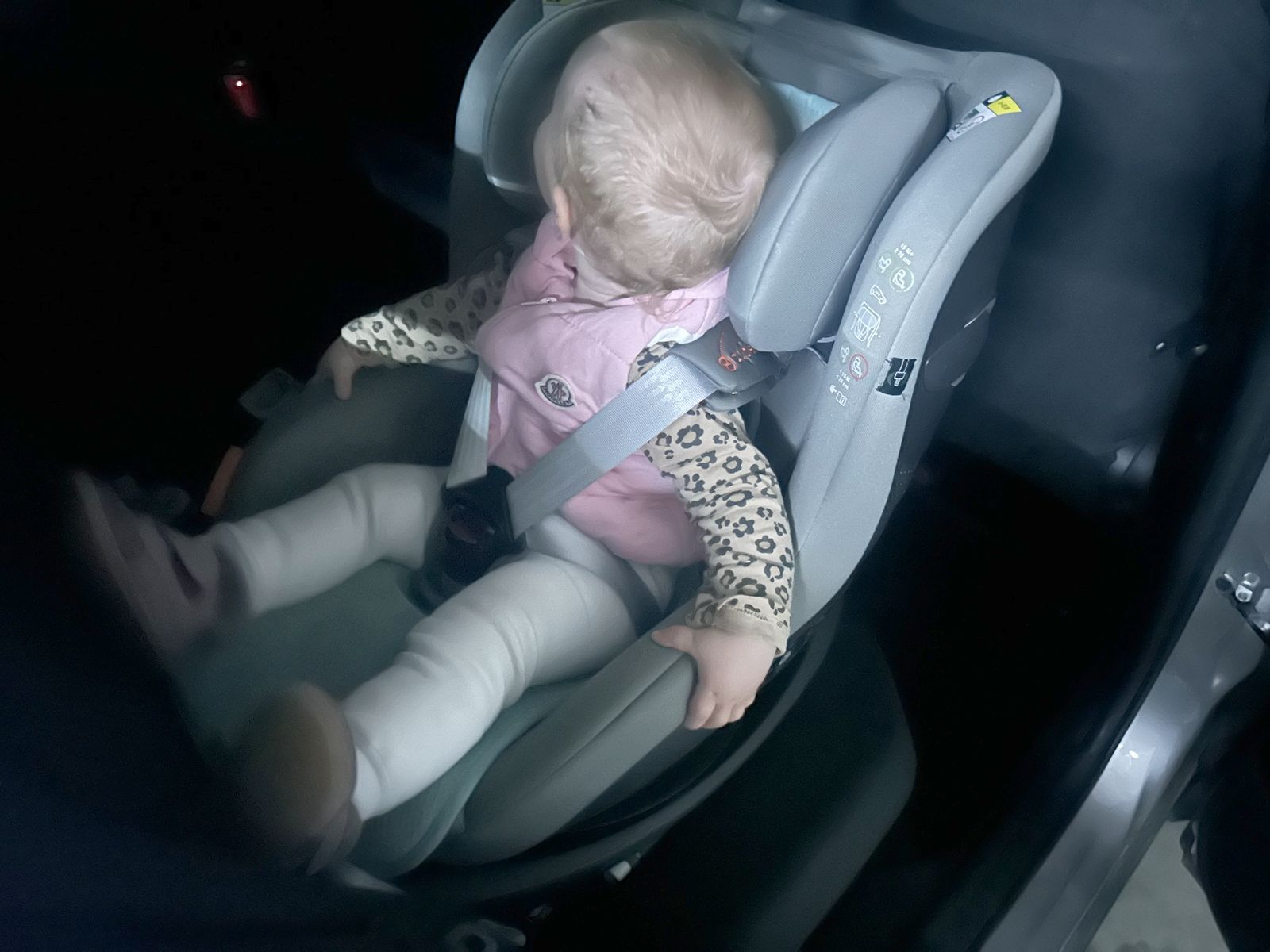 Becky buckled up in her car seat