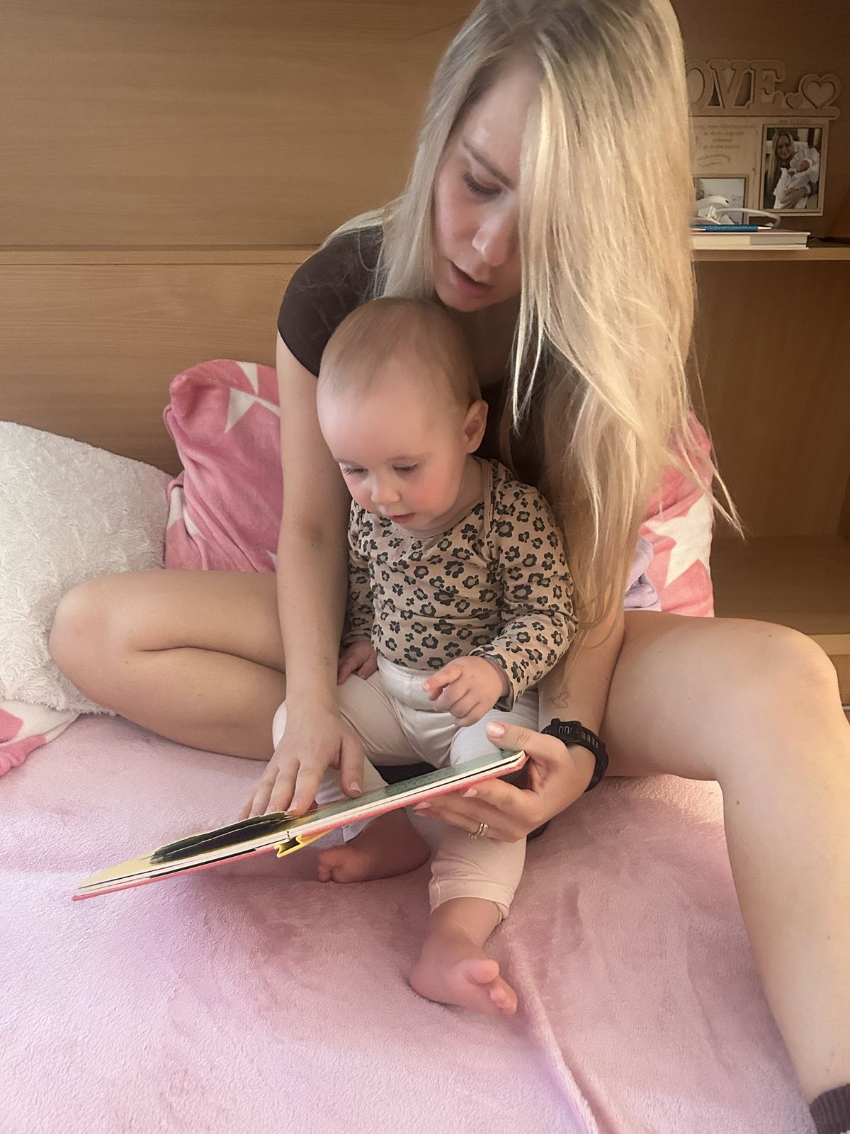 Reading a book together on the bed